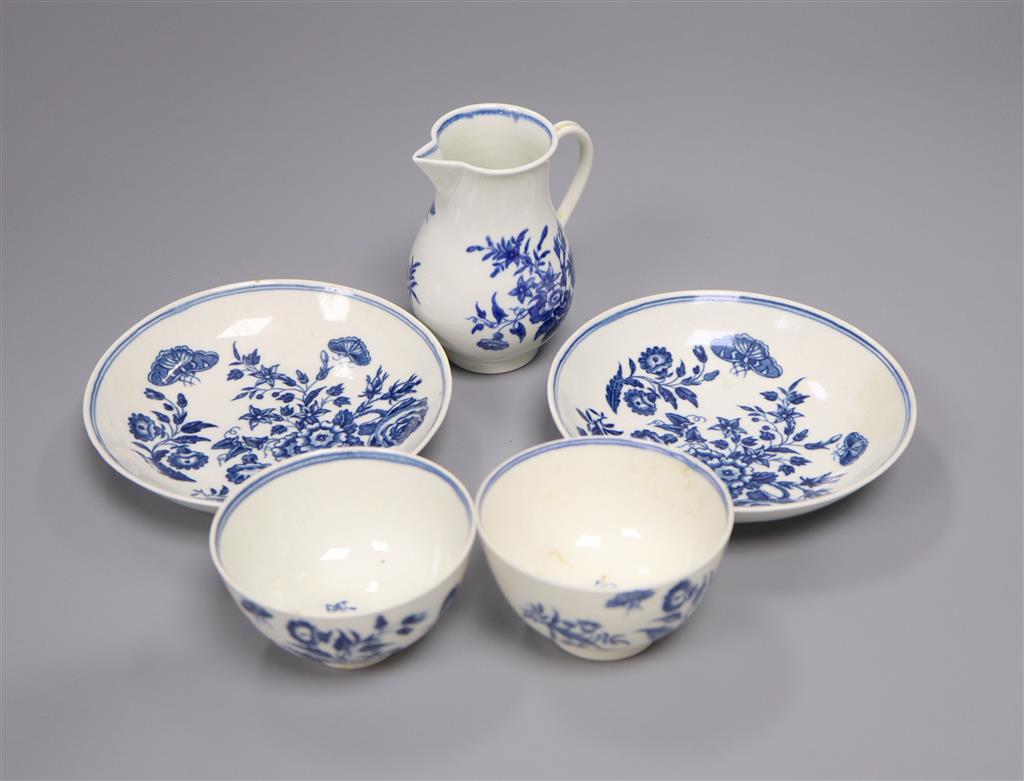 A group of Worcester Three Flowers tea wares, c.1775, comprising two tea bowls and saucers and a sparrow beak milk jug